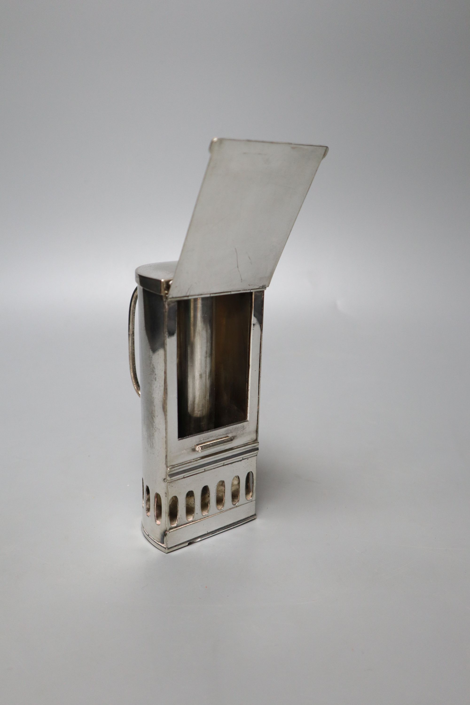 A pair of Victorian plated and embossed dwarf candlesticks and a Victorian plated pocket lamp, height 24cm (3)